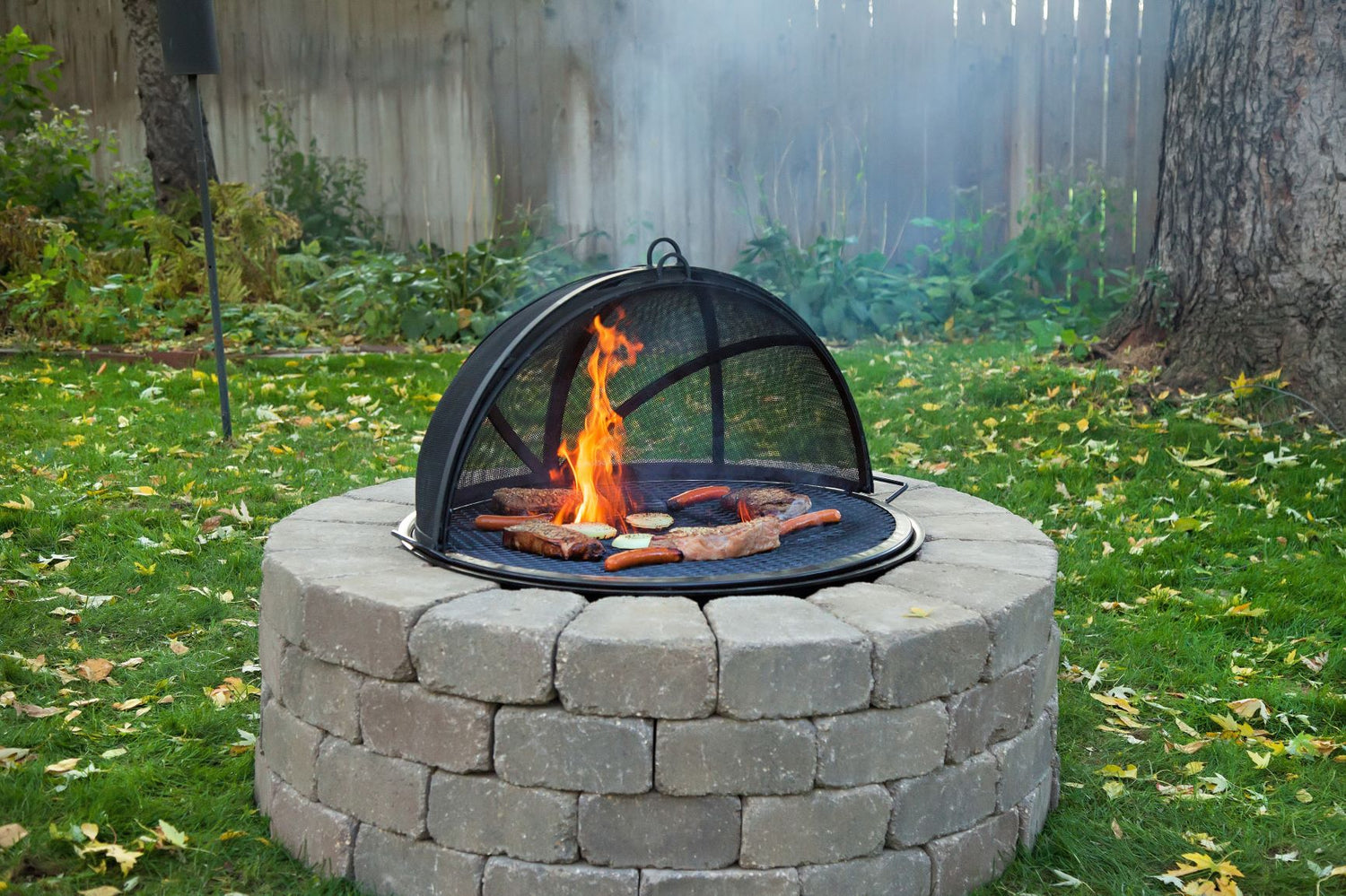Cooking over an open fire pit flame