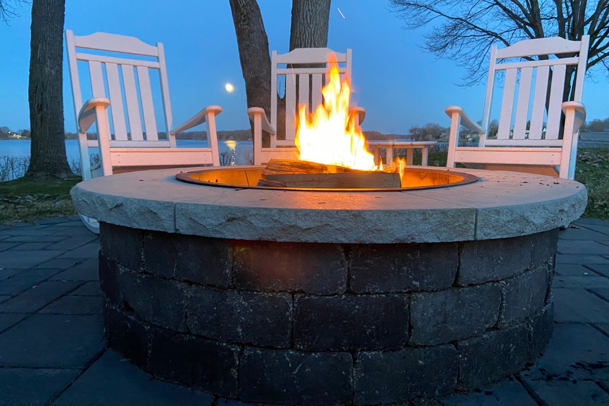 Outdoor fire pit with fireside essentials