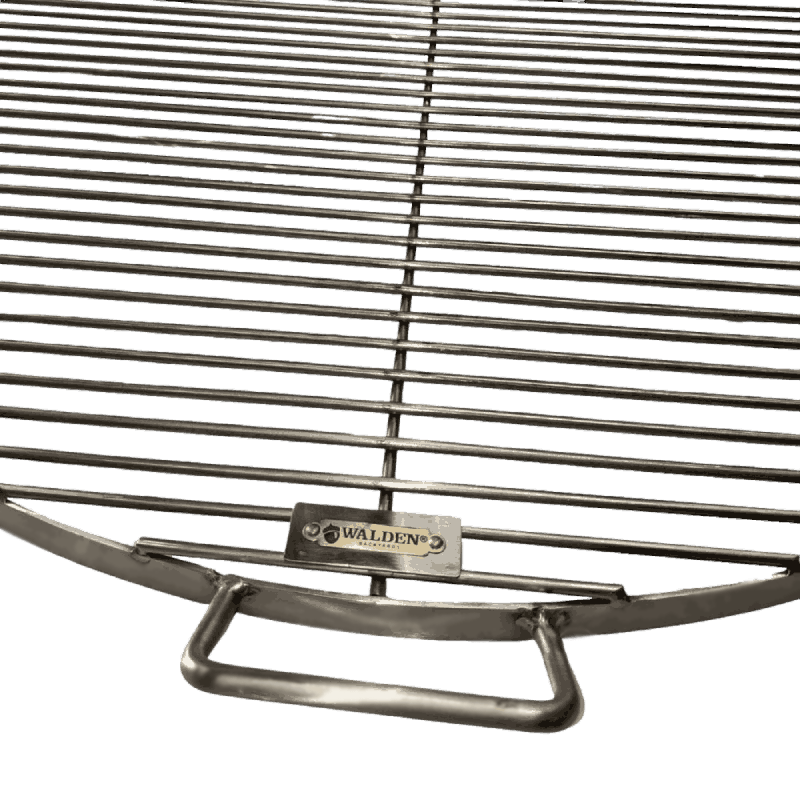 Close-up of beefy handle welded onto side of stainless steel grate.