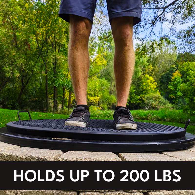 The Walden BBQ Grilling Grate holds up to 200 lbs. A person stands on a grilling grate placed over a fire pit to show sturdiness.