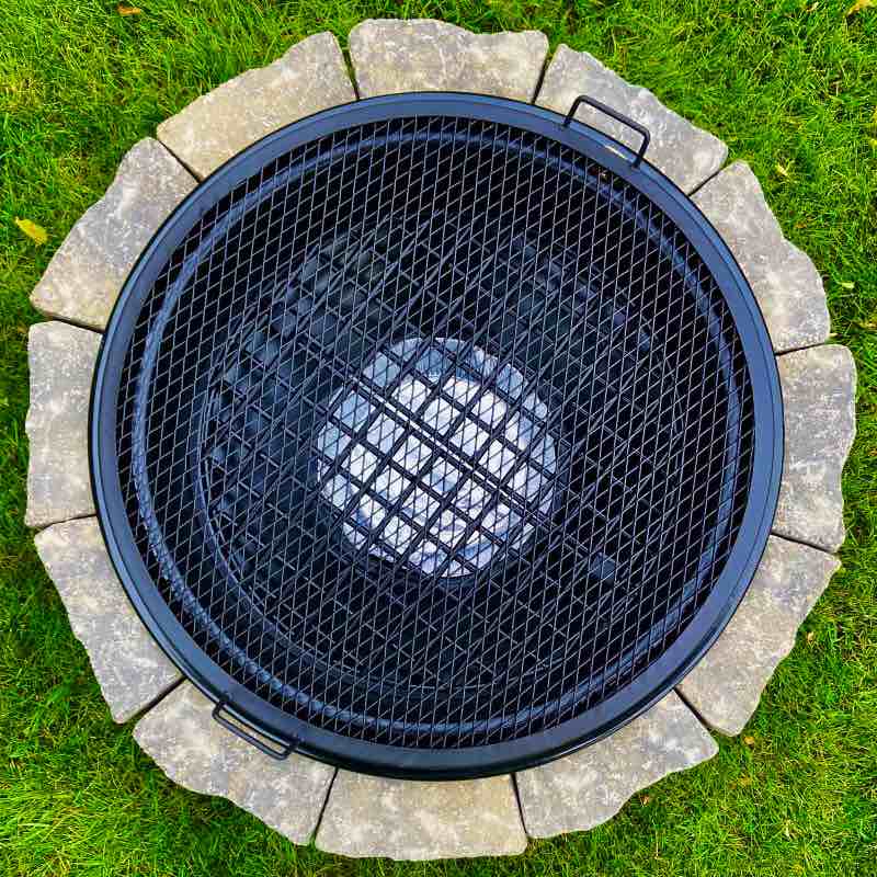 Circular BBQ Grate placed over Fire Pit to make a grill anywhere there is a fire.
