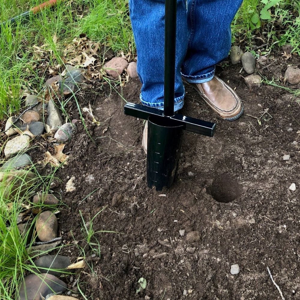 pull the spades out of the dirt to create a consistent hole for planting