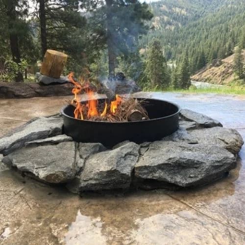 People gathering around a fire, conversation and connection