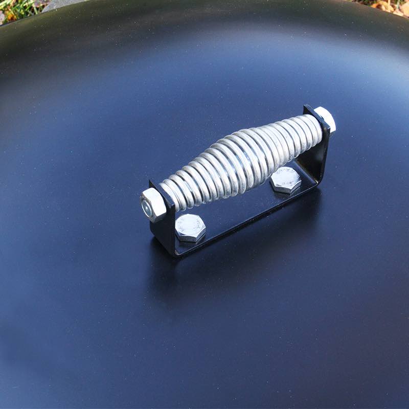 stainless steel cool touch handle at the top of the domed fire pit lid