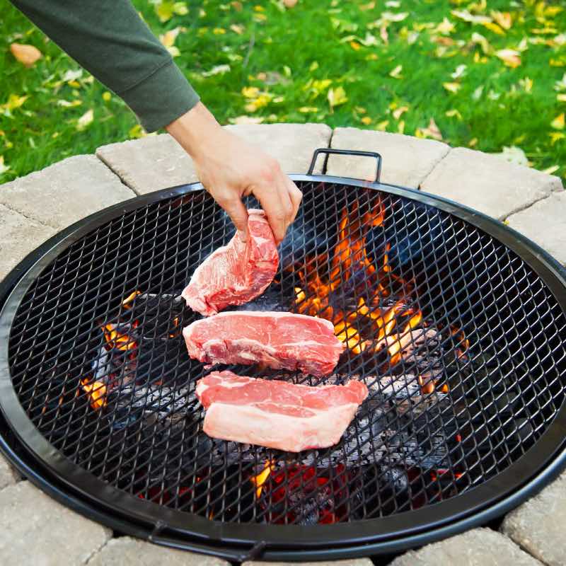Place steak over the fire on a BBQ Grilling Grate.