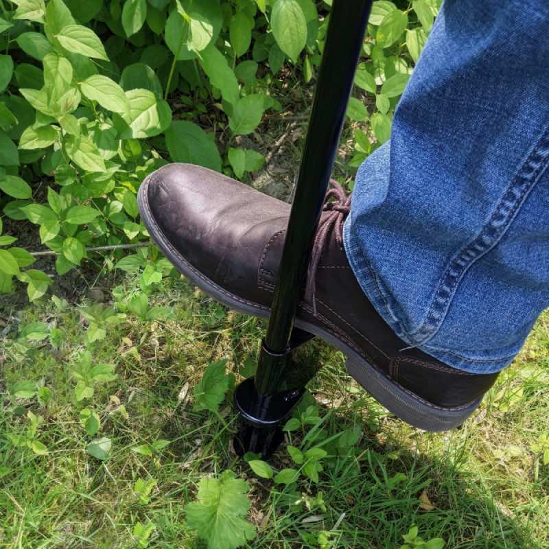 step down to plunge tines into ground to pull weed out from the ground