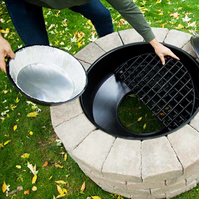place the ash line in the ash basin at the bottom of your legacy series complete fire pit insert